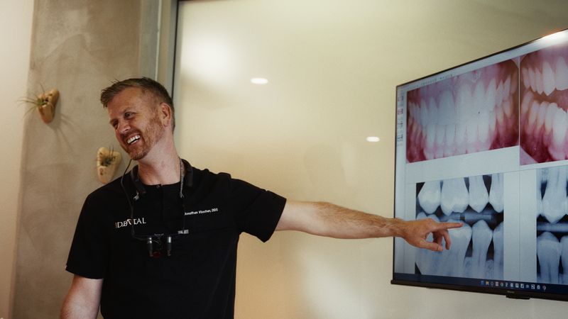 Dr. Visscher pointing at X-rays on the screen