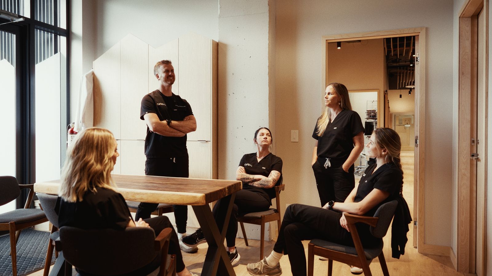 The Chief Dental team in a meeting room at the practice